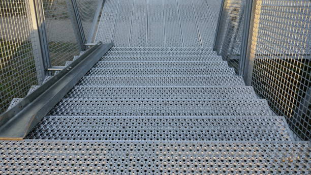 stairs, steel construction, galvanized, Grate steel staircase. External staircase with rail for bicycles on a cliff in Hohwacht, Schleswig-Holstein, Germany cattle grid stock pictures, royalty-free photos & images