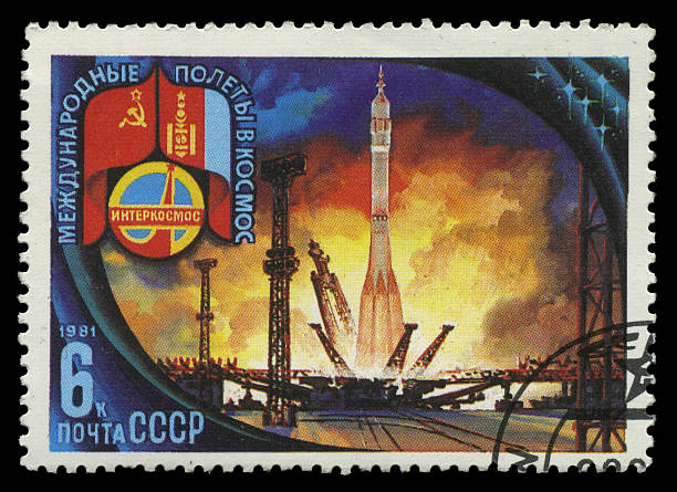 stamp, macro USSR - CIRCA 1981: A stamp depicts launching of a spaceship under the aegis of Intercosmos. There are flags of USSR and Mongolia in the upper left corner, circa 1981 baikonur stock pictures, royalty-free photos & images