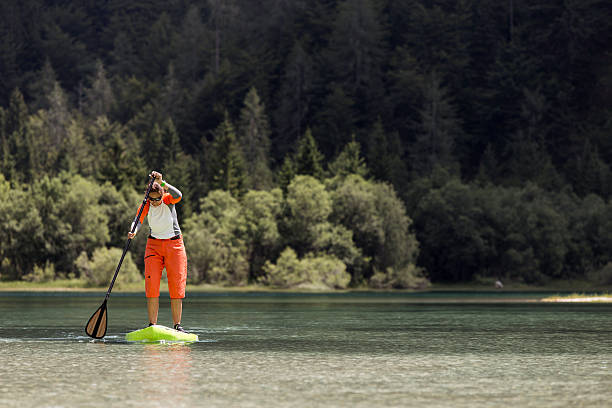 Stand up paddle boarding stock photo