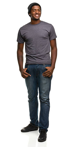Standing smiling man wearing jeans and a t-shirt Portrait of a man on a white background. http://s3.amazonaws.com/drbimages/m/jj.jpg t shirt photos stock pictures, royalty-free photos & images