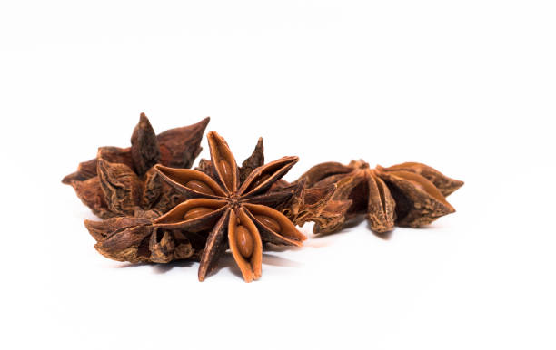 star anise white background a few star anise with a white background anise stock pictures, royalty-free photos & images