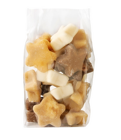 star shaped fondant in plastic bag isolated on white.