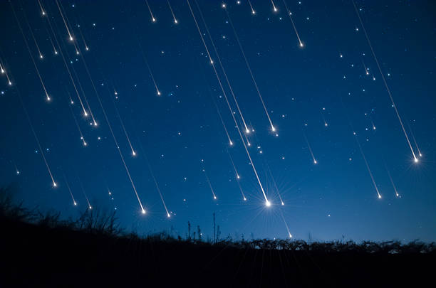 star shower - vallende sterren stockfoto's en -beelden