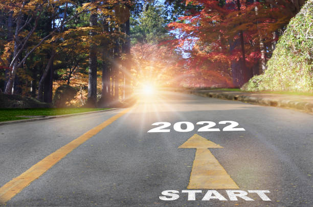 Start to 2022 with arrow and sunlight on autumn season background stock photo