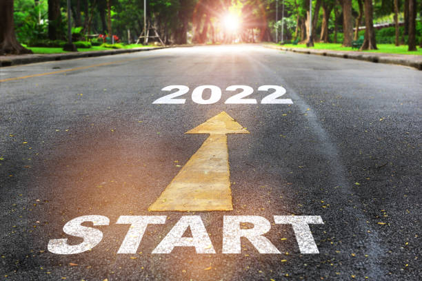 Start to 2022  written on the road on nature background with sunlight stock photo