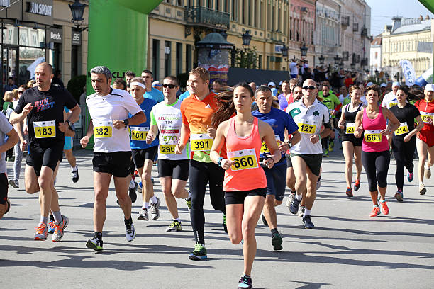 NOVI SAD, SERBIA - APRIL 03: Starting runners, participants Novi Sad, Serbia - April 3, 2016: Novi Sad, Serbia - April 3, 2016: Starting runners, participants in the Novi Sad Marathon in Novi Sad, Serbia on April 03, 2016. marathon stock pictures, royalty-free photos & images