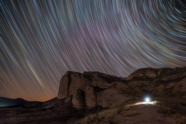 Startrails over a rock stock photo