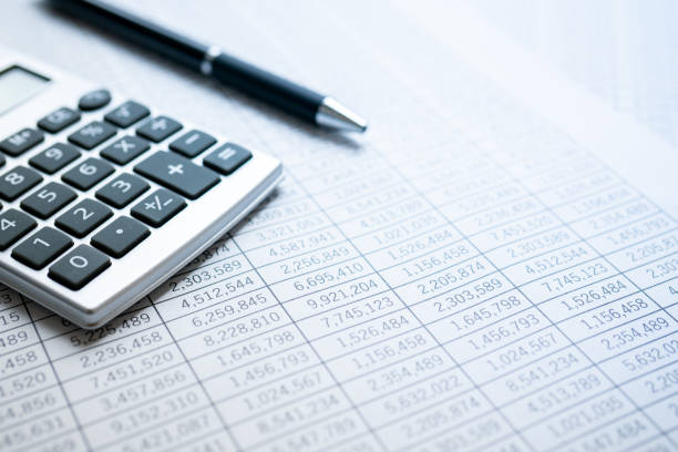 Statistics, calculator and ballpoint pen. Financial business calculation. Statistics, calculator and ballpoint pen. Financial business calculation. counting stock pictures, royalty-free photos & images