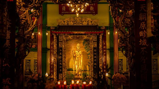 Statue In Illuminated Temple At Night