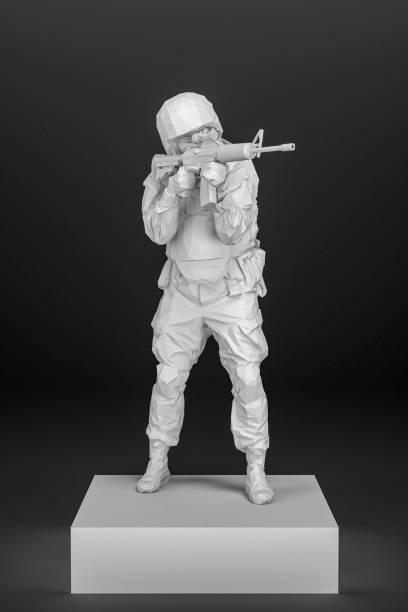 statue of a soldier. Army Soldier Figurine Made From A White Wireframe Standing On A Box Holding A Rifle, Isolated Against Black. stock photo