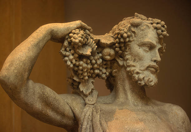 Statue of Bacchus holding his hair stock photo