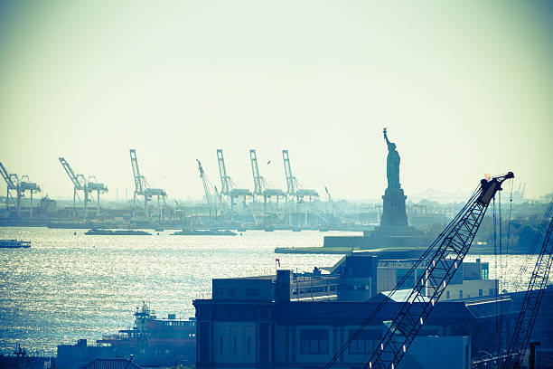 Statue of liberty and New York City port stock photo
