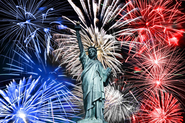 Statue of Liberty, blue white and red fireworks July 4th celebration in New York stock photo
