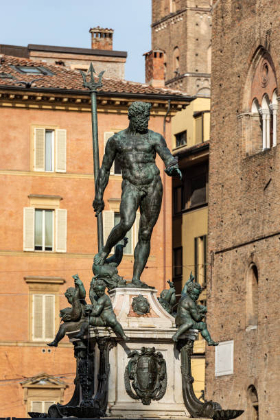 Statue of Neptune the Roman God - Bologna downtown Italy Bronze statue of Neptune (1566), Roman God, fountain in Piazza del Nettuno, Bologna downtown, Emilia-Romagna, Italy, Europe. Artist Giambologna (1529-1608) poseidon statue stock pictures, royalty-free photos & images