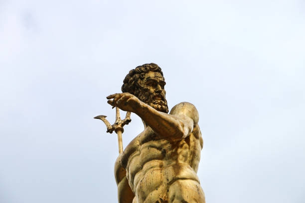 Statue of Poseidon, God of the Sea in Batumi Batumi, Georgia-July 27, 2018: Statue of Poseidon, God of the Sea in Batumi. The statue was taken as a half portrait and is in gold color. poseidon statue stock pictures, royalty-free photos & images