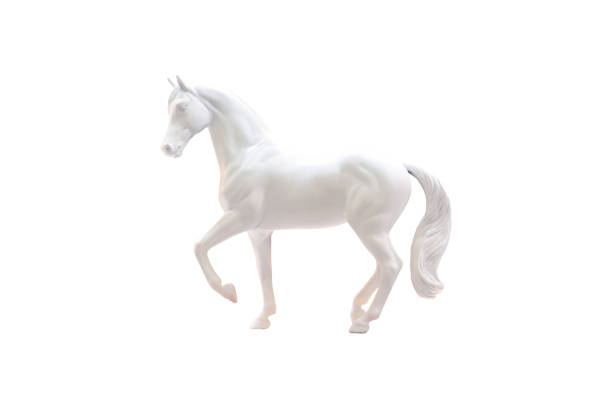 Statuette of white horse isolated on white. stock photo