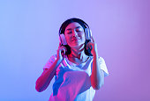 istock Stay alone at home during covid-19 and relax at spare time with music 1302986496