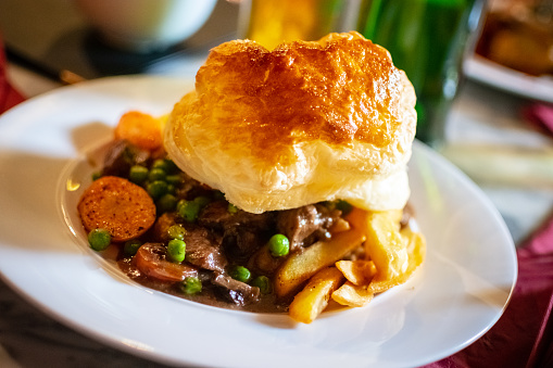 Steak Ale Pie With Puff Pastry And Chips Stock Photo ...