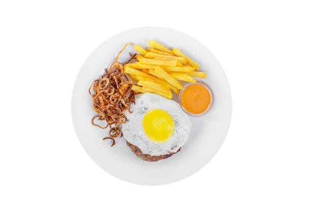 Steak with eggs, french fries isolated white stock photo