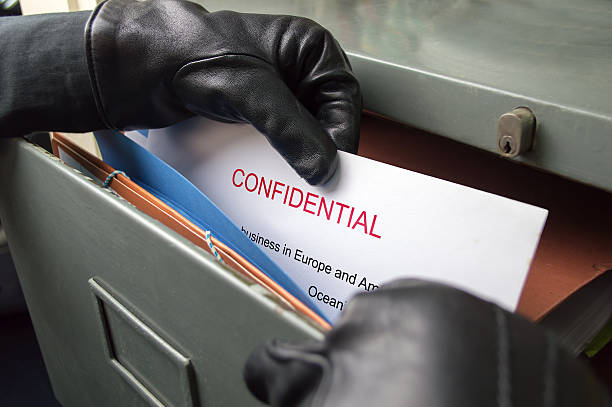 stealing secrets documents thief stealing confidential files in an office top secret stock pictures, royalty-free photos & images