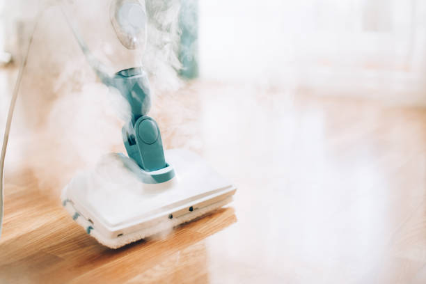 Steam cleaner mop cleaining floor. Banner with copy space. Cleaning service concept Steam cleaner mop cleaining floor. Banner with copy space. Cleaning service concept. cleaner stock pictures, royalty-free photos & images