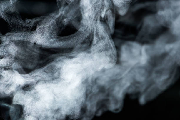 Steam patterns of smoking electronic cigarette or boiling water stock photo