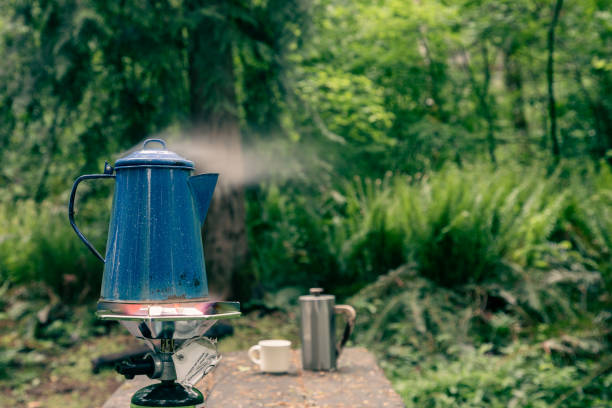 Steam Rises From Coffee Pot as water boils for Camp Coffee stock photo