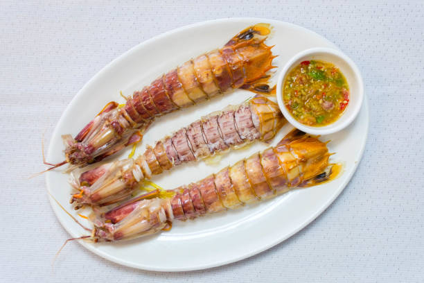 steamed crayfish or mantis shrimps on white disk stock photo