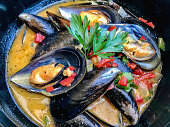 Bowl of steamed mussels in a savory cream sauce