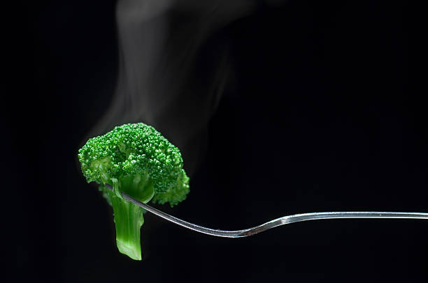 Steaming Broccoli on a Fork stock photo
