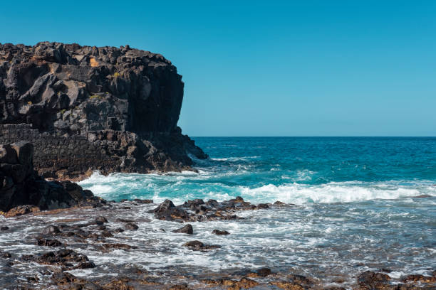 Steep cliffs and rough volcanic coast at the Natural Reserve of Malpais de la Rasca, Tenerife, Canary Islands, Spain stock photo