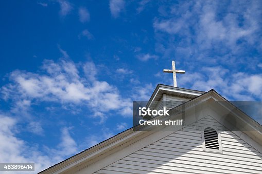 istock Steeple And Cross Set Against A Blue Sky 483896414