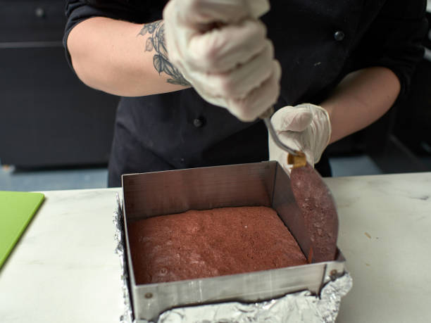 Step-by-step preparation of black designer cake. cooked chocolate sponge cake. stock photo
