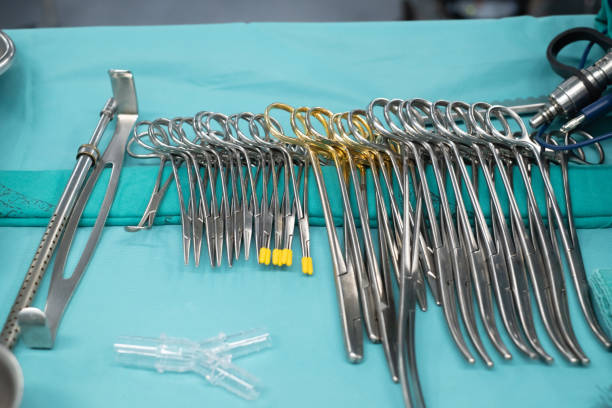 Sterile scissors and other medical instruments. Surgical equipment and medical devices in operating room. Sterile scissors and other medical instruments. stock photo