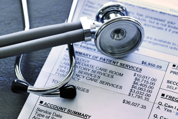 Stethoscope And Hospital Invoice A stethoscope rests on top of a very expensive medical invoice that has line items for different services provided. expense stock pictures, royalty-free photos & images