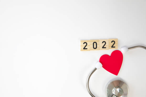 stethoscope with 2022 isolated on white background. happy new year for health care and medical banner calendar cover. creative idea for new trend in medicine treatment and diagnosis concept.copy space - coronatest netherlands stockfoto's en -beelden