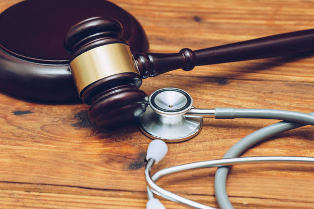 Stethoscope with judge gavel. Concept of healthcare and medicine, malpractice, legal system. Stethoscope with judge gavel. Concept of healthcare and medicine, malpractice, legal system.   Injury Lawyer stock pictures, royalty-free photos & images