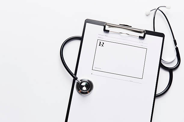 Stethoscope with prescription pad on clipboard with copy space. stock photo