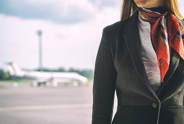Stewardess on the airfield. Place for your text. Stewardess on the airfield. Place for your text. crew stock pictures, royalty-free photos & images