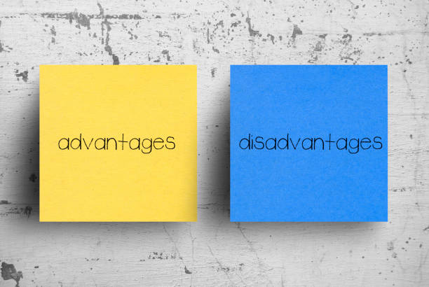 Sticky note on concrete wall, Advantages Disadvantages stock photo