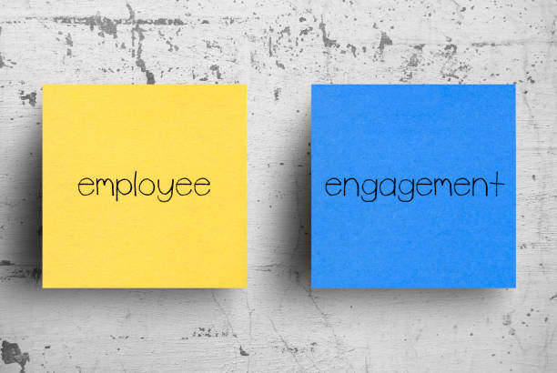 Sticky note on concrete wall, Employee Engagement Sticky note on concrete wall, Employee Engagement employee engagement stock pictures, royalty-free photos & images