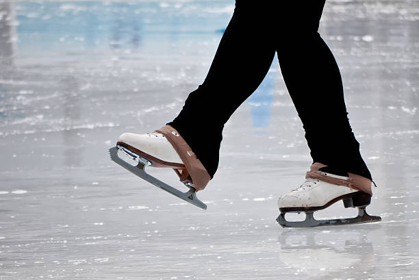 Still capture of recreational figure skater ice skates stock photo