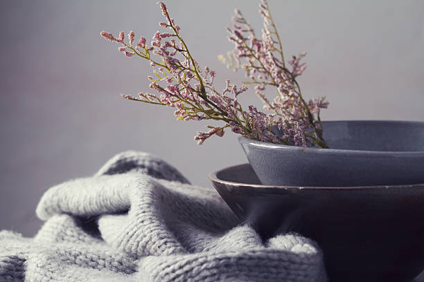 Still life gray vintage bowls with flowers horizontal Still life gray vintage bowls with pink flowers and woolen scarf horizontal still life stock pictures, royalty-free photos & images