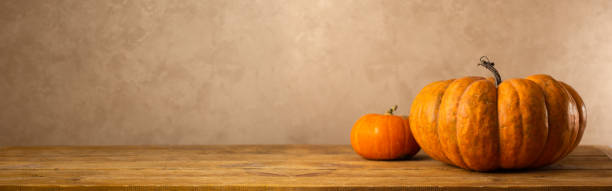 Still life of different type pumpkin on wooden table stock photo