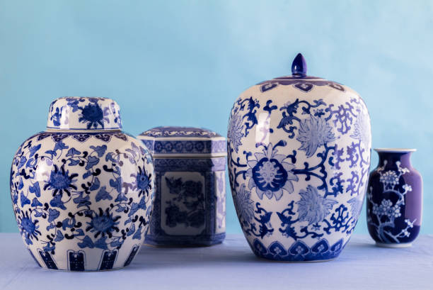 Still life with blue and white ceramic pots and ginger jars with differential focus - space for text stock photo