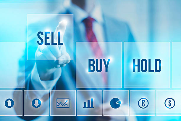 Stock market concept Stock concept business man pointing buy single word stock pictures, royalty-free photos & images