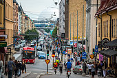 Stockholm, Sweden -  August 3, 2016: Stockholm street with people walking and cycling, Sweden