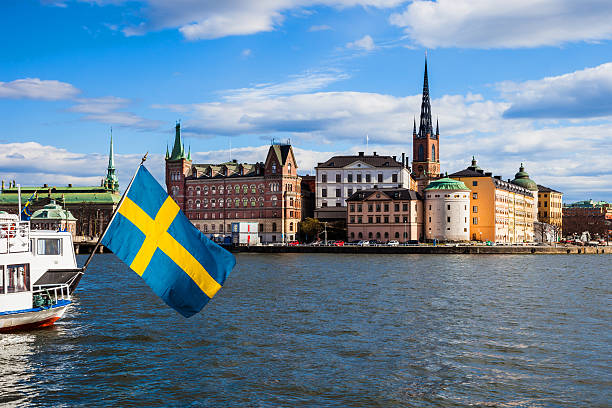 stockholm, sweden. scenic view of the old town and church - swedish flag bildbanksfoton och bilder
