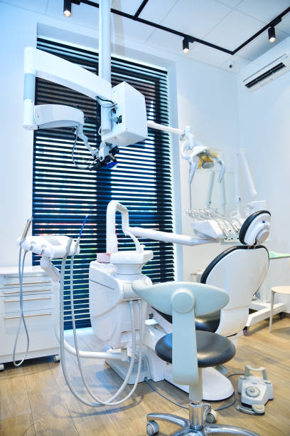 Stomatological clinic with dental chair. stock photo