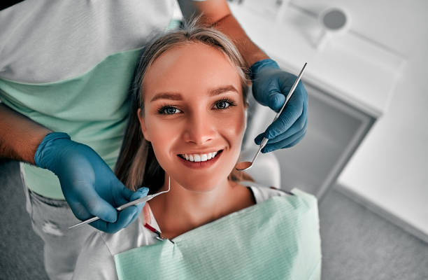 Stomatology Perfect smile! Part of dentist examining his beautiful patient in dentistâs office. dentist stock pictures, royalty-free photos & images